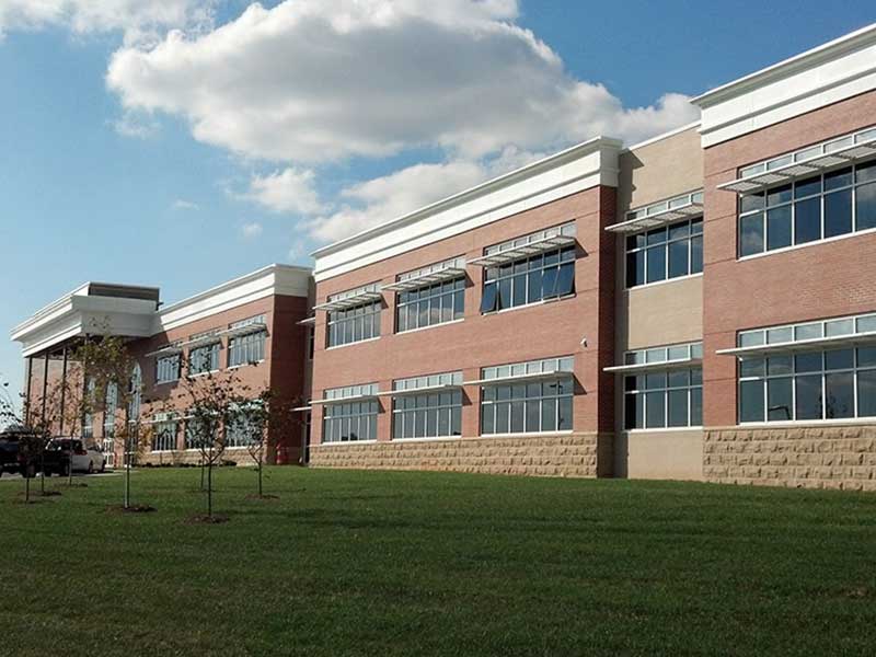 High School Rebuilt after Hurricane Katrina in LA with Quad-Deck school finished exterior